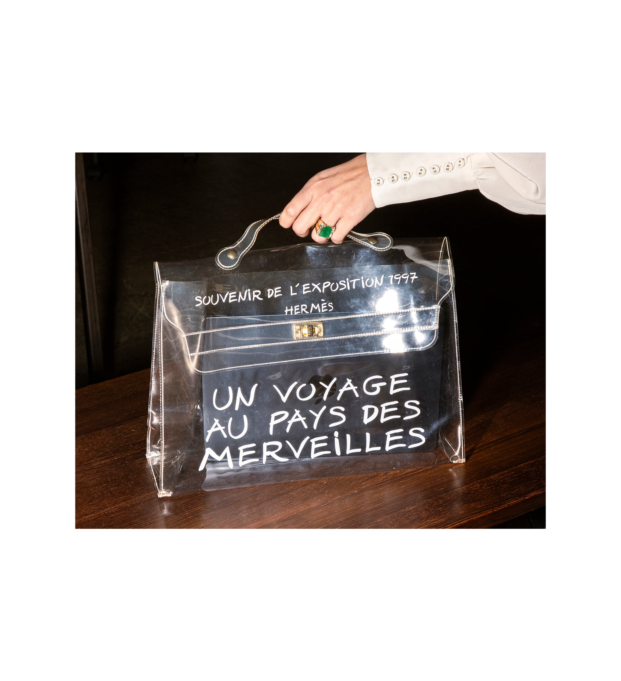 Clear bag with "Un Voyage au Pays des Merveilles" text, souvenir from 1997 Hermes exhibition - HerAge