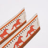 Hermès Sequences Horse Twilly Scarves in Orange Secondhand