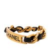 Chanel Gold Plated Leather Woven Chain Logo Plate Cuff Bracelet Secondhand