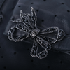 Secondhand Chanel Black Perforated Lambskin Fingerless Gloves with Crystal Bow Detail - '20s