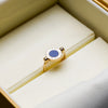 Bvlgari gold ring with blue centre detail in presentation box