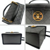 Chanel quilted cosmetic bag in black leather and gold chain