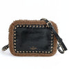 Valentino Garavani Rockstud shearling shoulder bag in black patent leather