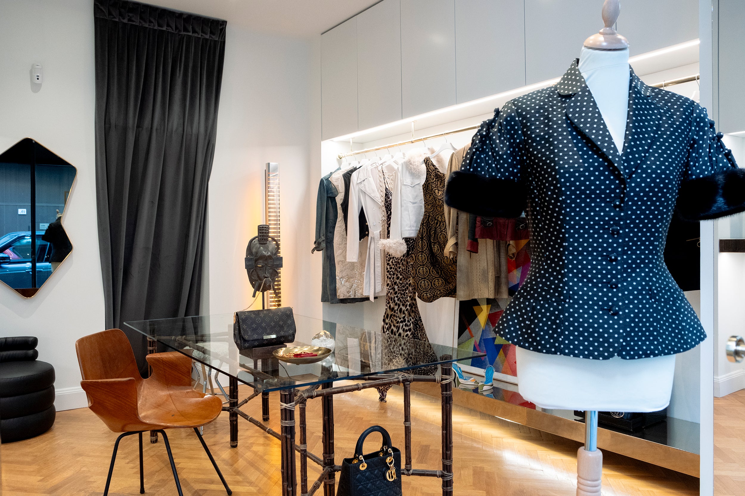 Her-Age Milan boutique interior in Brera with curated vintage luxury fashion, designer handbags and private client consultation area.